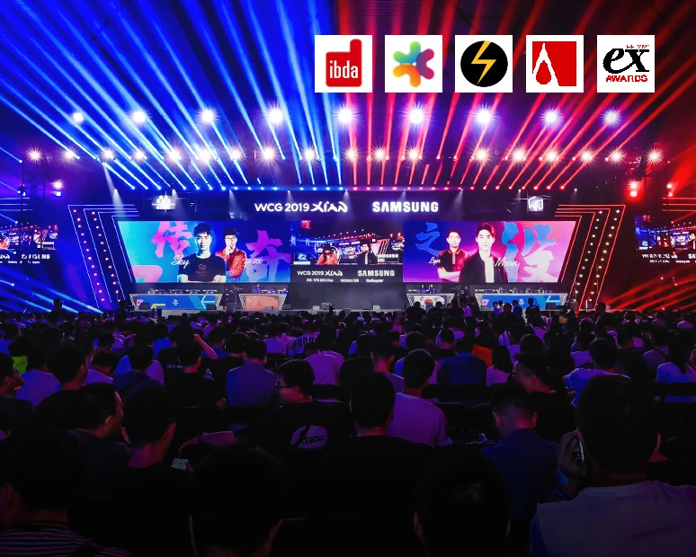 eSports global events WCG 2019 XiAN Samsung_big stage live esports streaming and crowd with backlight blue and red, awards logo at the top of the picture